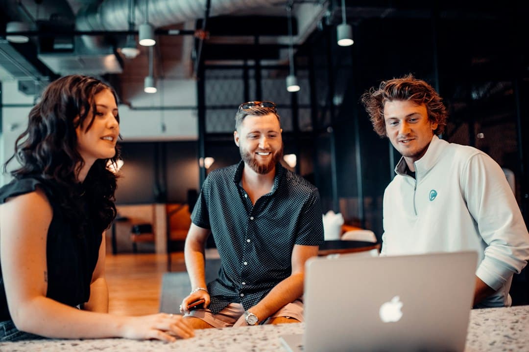 A diverse team collaborating in a meeting room, discussing strategies for building trust through website accessibility