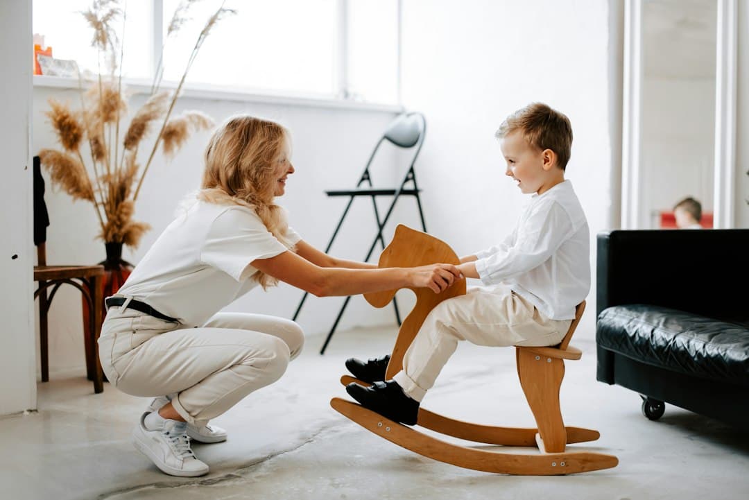 A therapist engaging with a child in a calm, welcoming office setting, illustrating a supportive therapy environment.