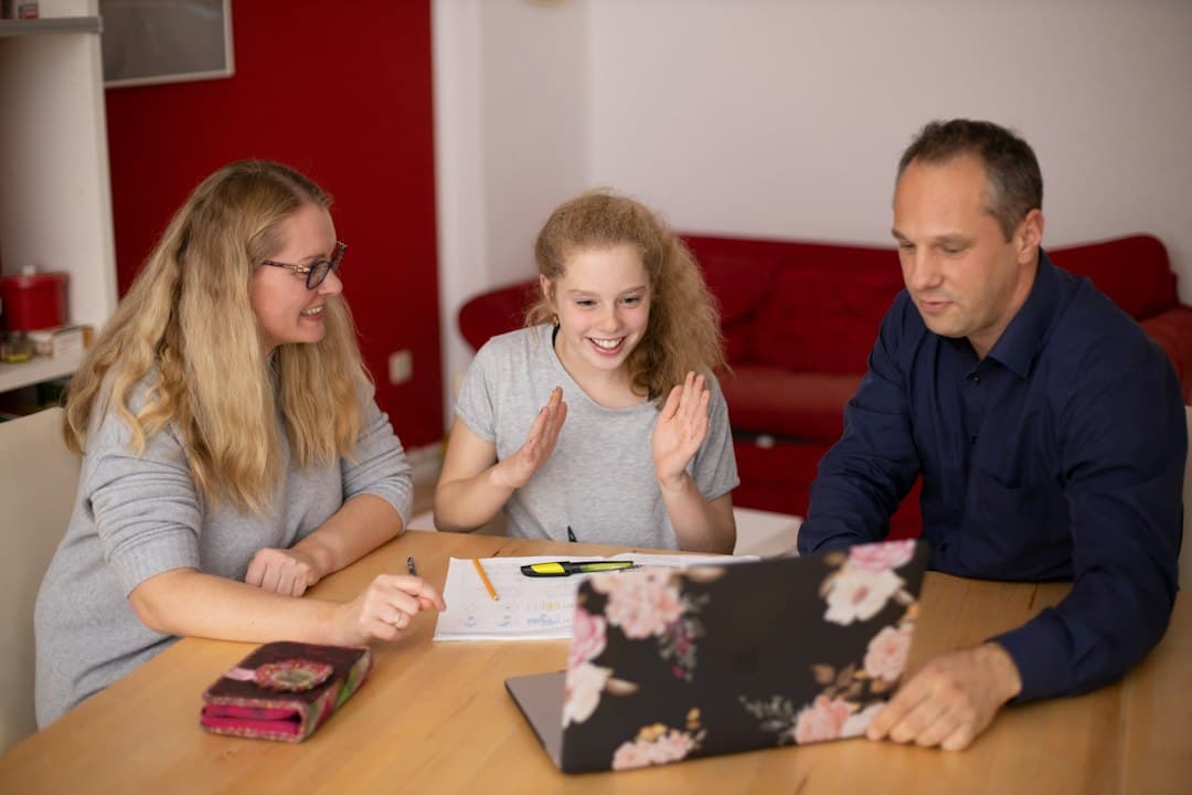 Parents having a conversation with a therapist in a comfortable office, emphasizing trust-building in therapy marketing.
