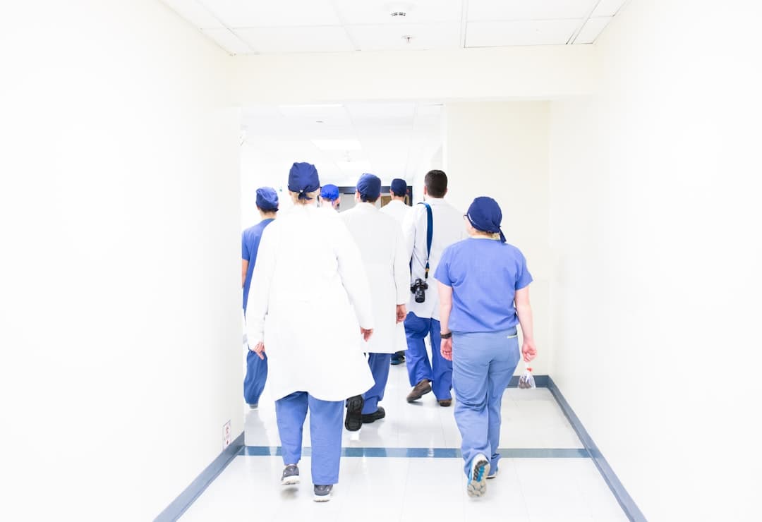 A team of healthcare professionals discussing strategies in a meeting room, emphasizing collaboration in marketing efforts.