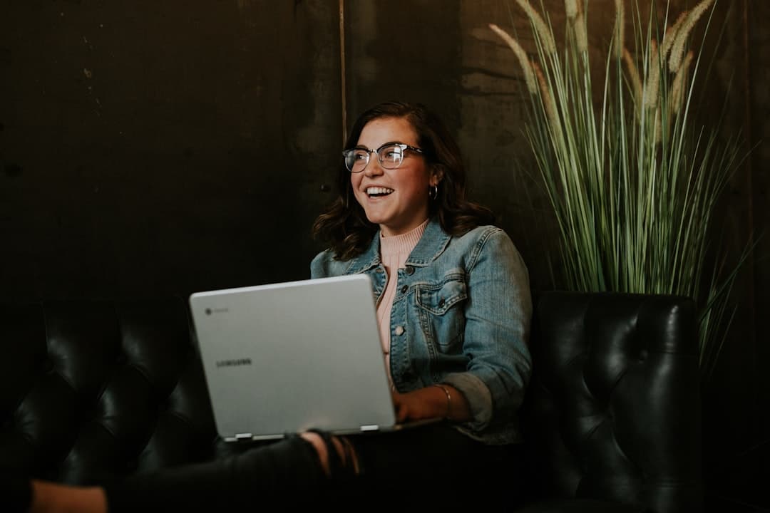 A massage therapist updating their Google Business Profile on a laptop, highlighting digital marketing efforts.