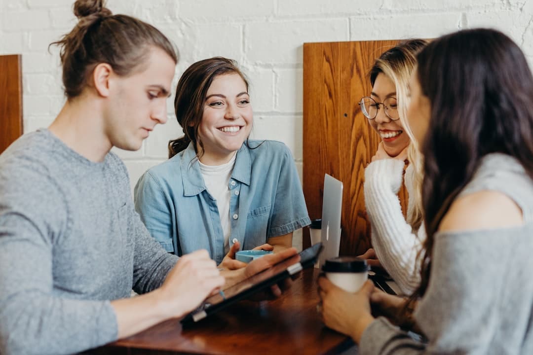 A team of professionals discussing review strategies in a meeting room, emphasizing collaborative review management.