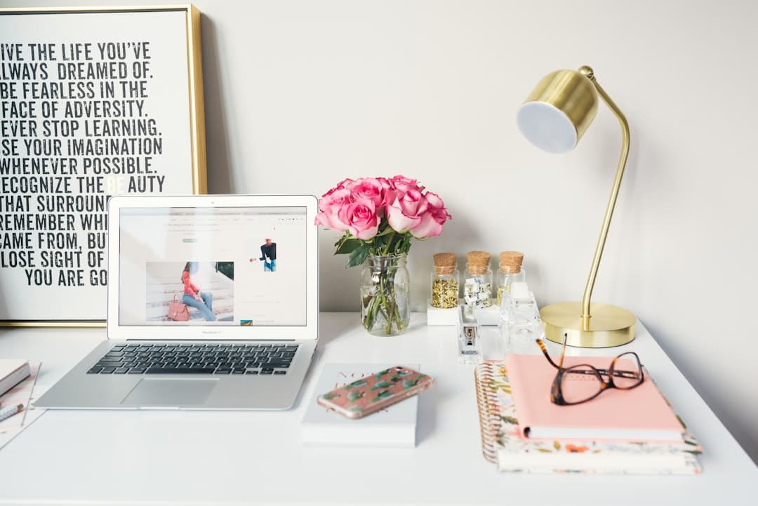 A well-organized therapy office desk with a laptop and notepad, setting a professional tone for discussing therapy fees