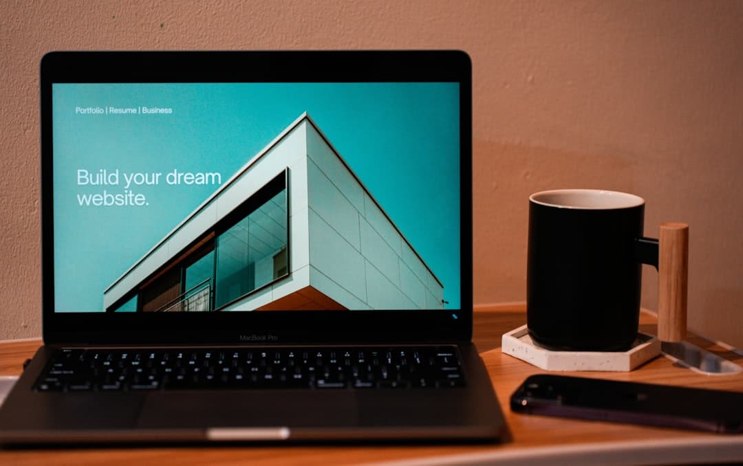 A person working on a laptop, focusing on building an online presence for a dietitian practice through a professional website.