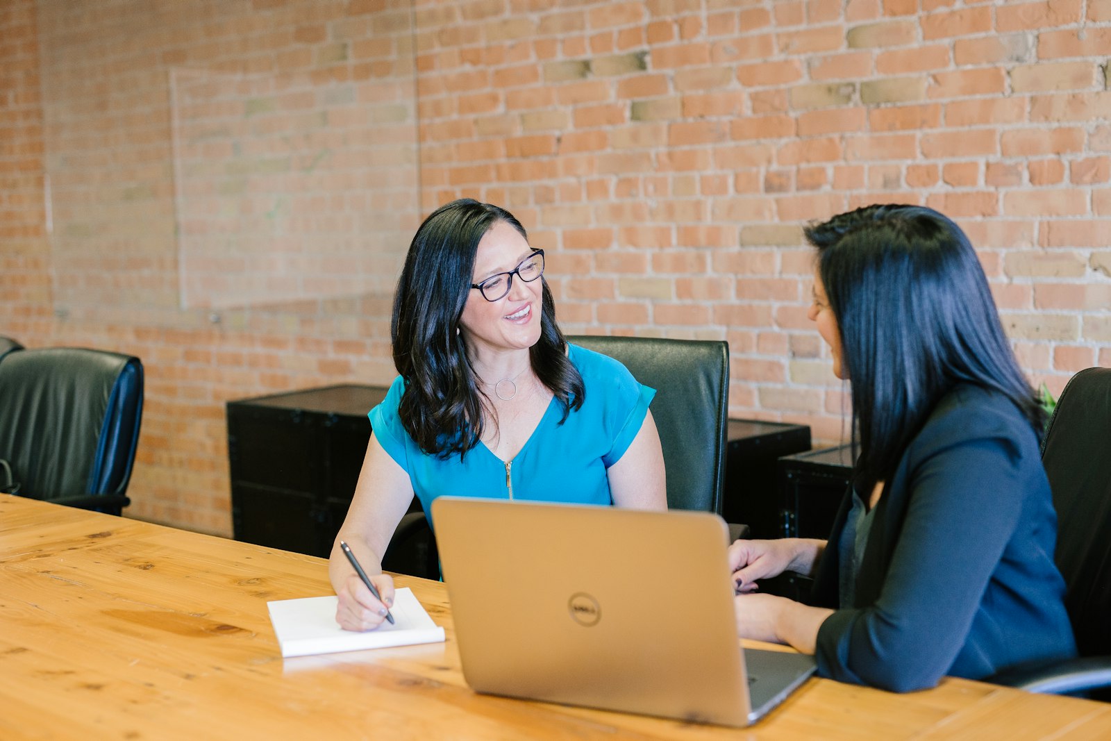 Therapist-owner presenting practice systems to a colleague